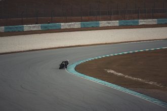 Motorcycle turning at high speed at Sepang Circuit
